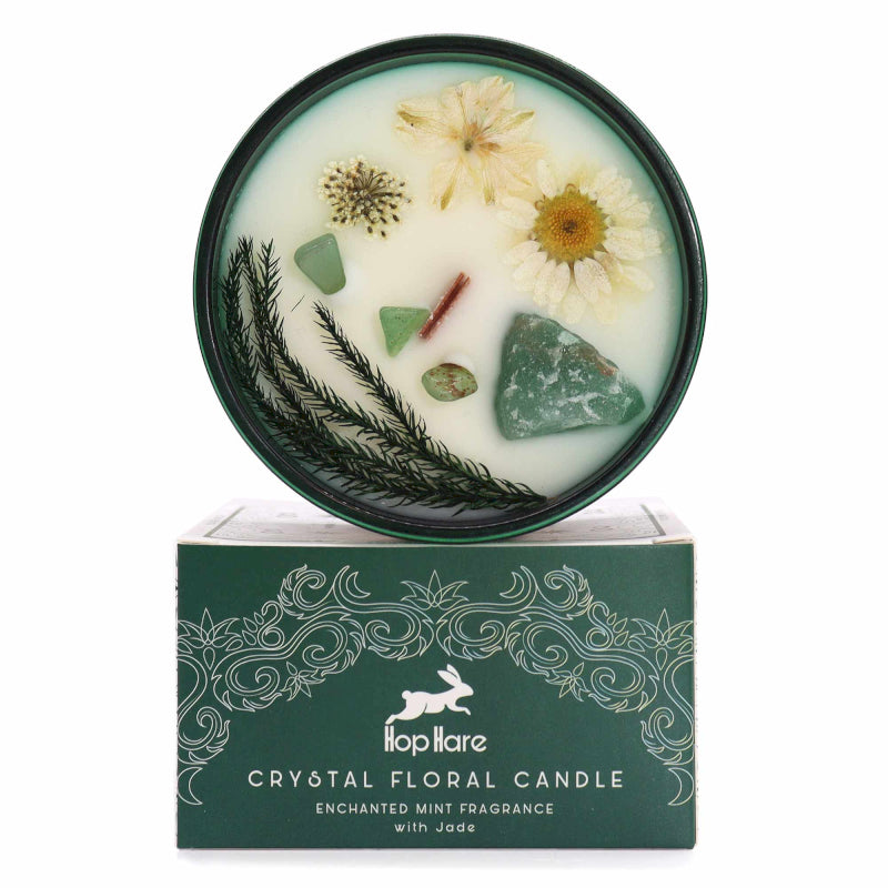 Crystal floral candle with decorative elements on a white background