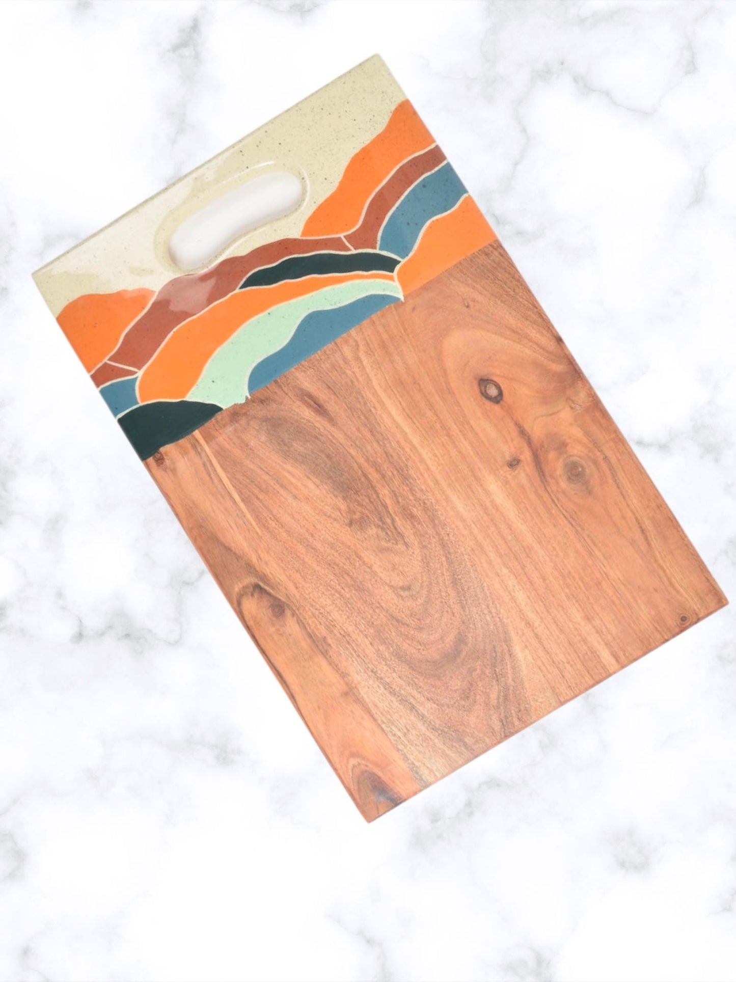 Elevate your kitchen aesthetics with this exquisite enameled mango wood chopping board, a perfect blend of functionality and artistry. Crafted from highly durable and water-resistant mango wood, this multi- purpose