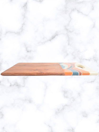 Elevate your kitchen aesthetics with this exquisite enameled mango wood chopping board, a perfect blend of functionality and artistry. Crafted from highly durable and water-resistant mango wood, this multi- purpose